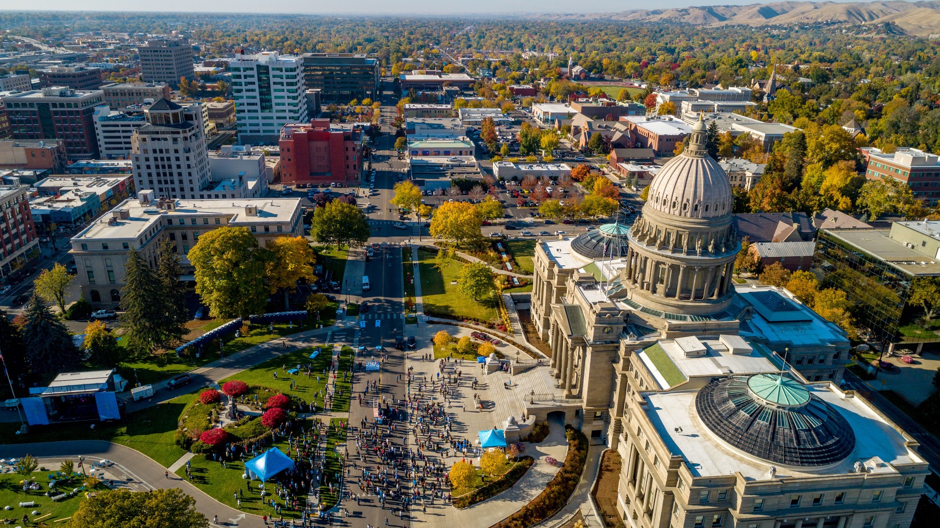 People gather for a celebration on the lawn in front of the Capital building in Idaho